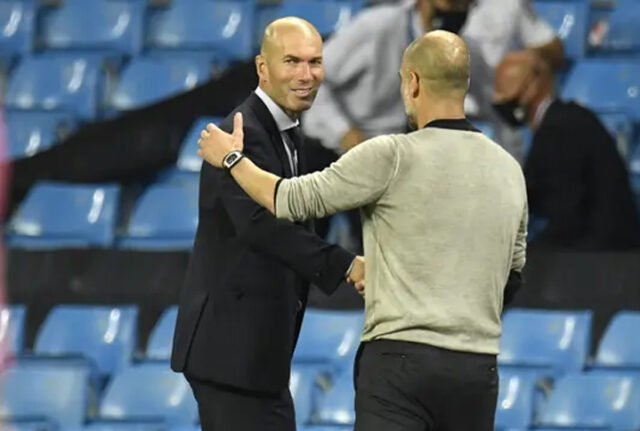 Pelatih Real Madrid, Zinedine Zidane, berjabat tangan dengan Manajer Manchester City, Pep Guardiola, usai laga leg kedua babak 16 besar Liga Champions di Etihad Stadium, Sabtu (8/8/2020) dini hari WIB.(Peter Powell / Foto Pool via AP) Pelatih Real Madrid, Zinedine Zidane, berjabat tangan dengan Manajer Manchester City, Pep Guardiola, usai laga leg kedua babak 16 besar Liga Champions di Etihad Stadium, Sabtu (8/8/2020) dini hari WIB.(Peter Powell / Foto Pool via AP)