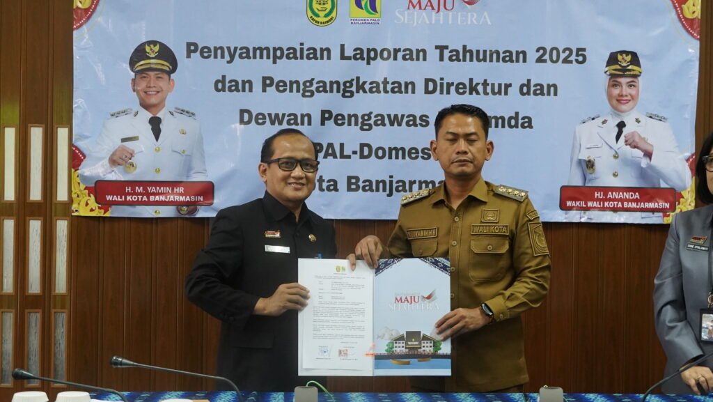 Kepala Dinas Koperasi, Usaha Mikro, dan Tenaga Kerja (Diskopumker) Kota Banjarmasin, Machli Riyadi (Kiri) dan Wali Kota Banjarmasin Muhammad Yamin HR (kanan. Foto Dok Istimewa