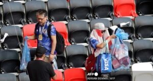 Suporter Jepang Kembali Curi Perhatian di Piala Dunia 2026, Bersihkan Stadion Usai Laga Kontra Belanda Ilustrasi Suporter Jepang bersih-bersih stadiun setelah pertandingan Piala Dunia 2026(AFP/ ADRIAN DENNIS)